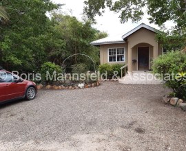 H440 – Beautiful lagoon waterfront home in Plantation with vacant beach lot for sale